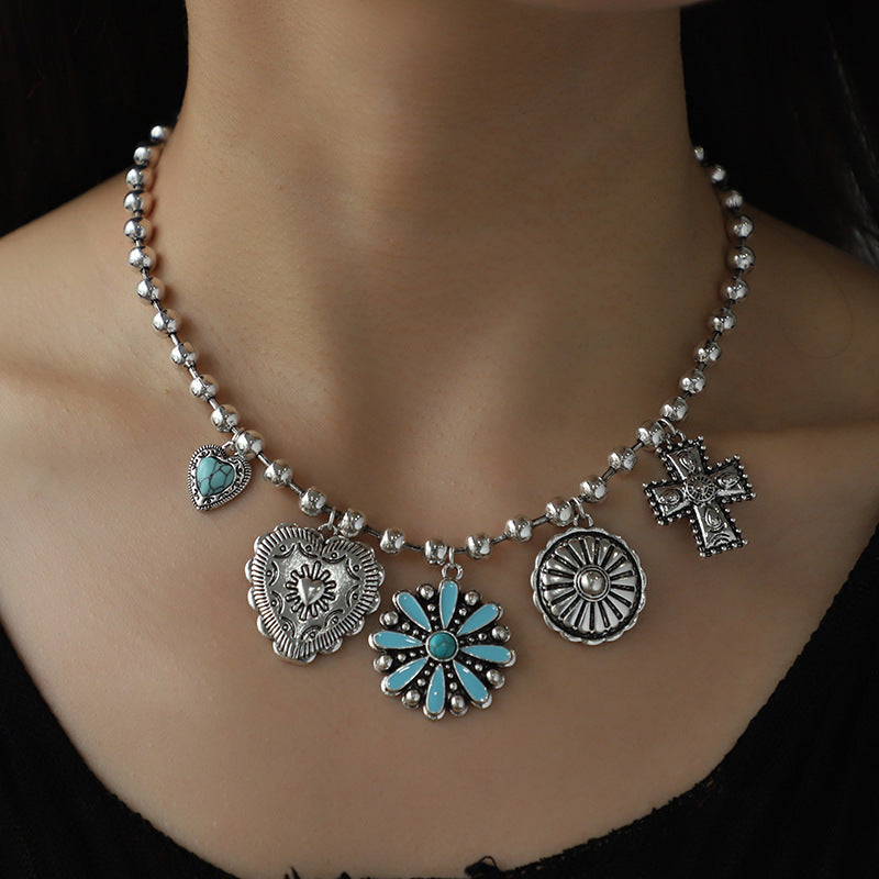 Western turquoise charm necklace with silver concho flower and cross charms by Turquoise Vintage
